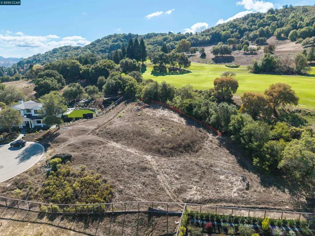 a view of a garden with a building