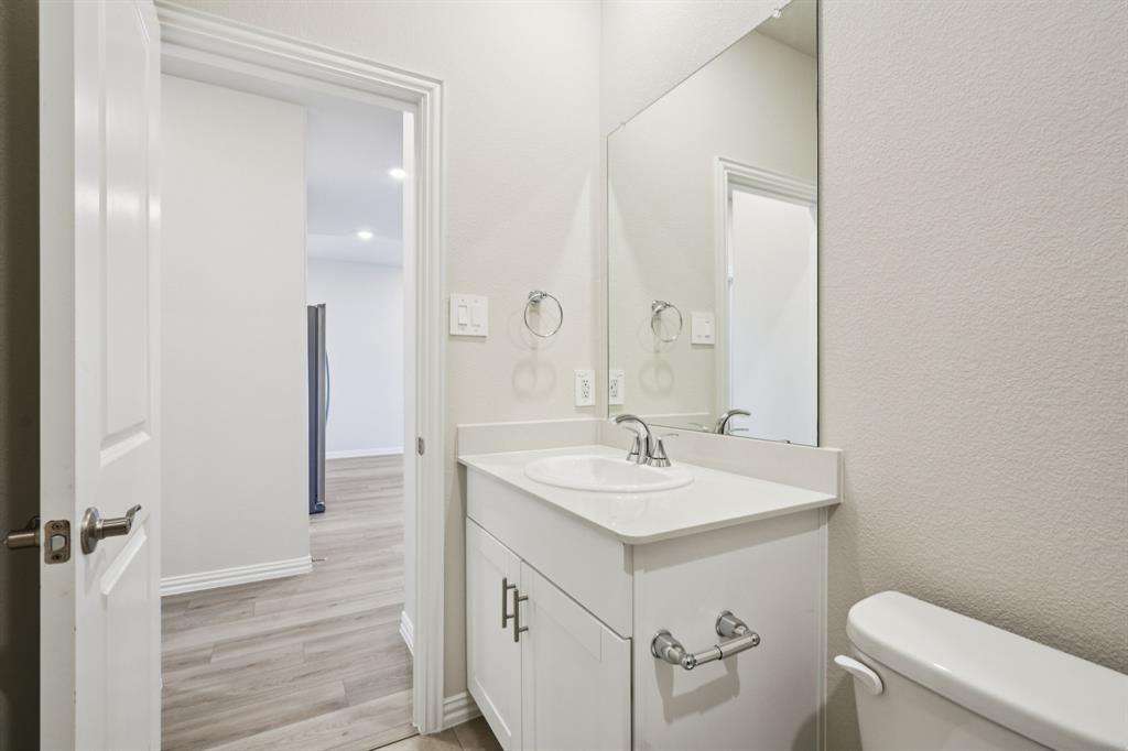 1632 Arches Road Anna, TX 75409 - Photo 12 of 29 a bathroom with a sink a toilet and shower