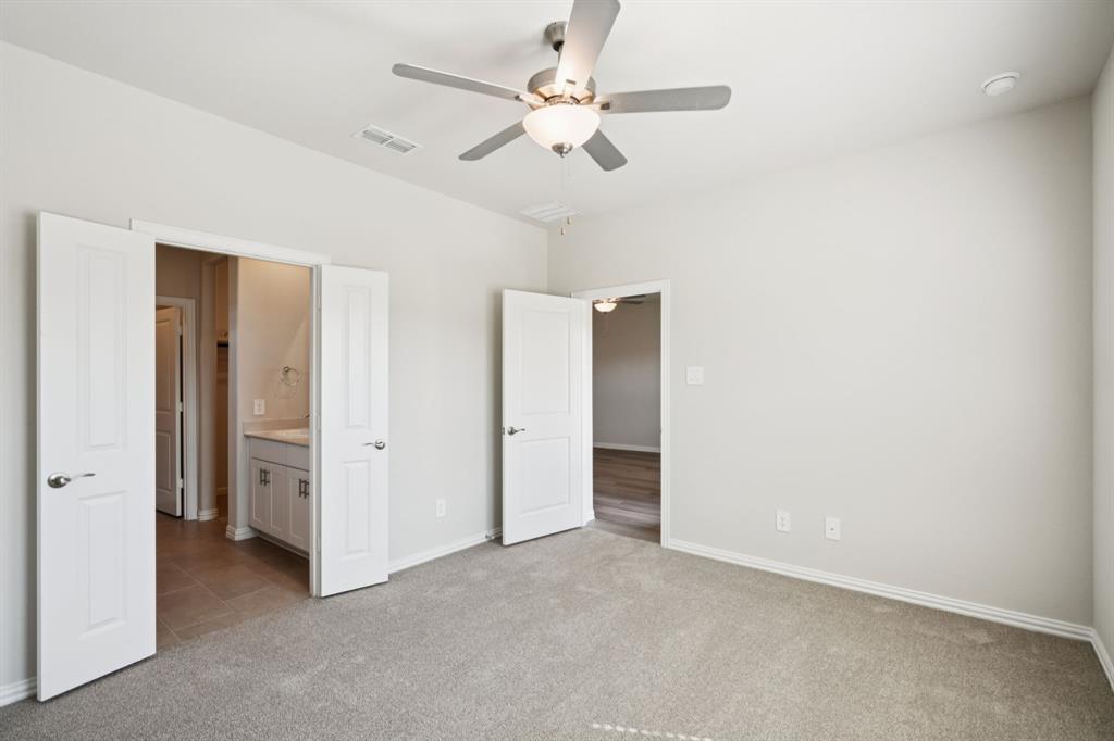 1632 Arches Road Anna, TX 75409 - Photo 17 of 29 an empty room with fan and a ceiling fan