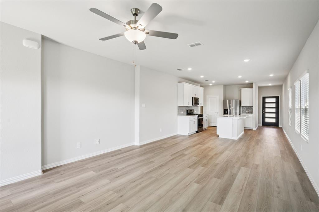 1632 Arches Road Anna, TX 75409 - Photo 6 of 29 a view of a kitchen with a sink and wooden floor