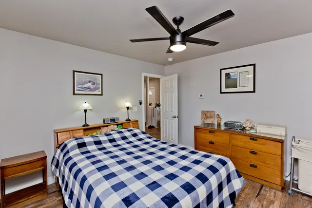 a bedroom with a bed and a dresser