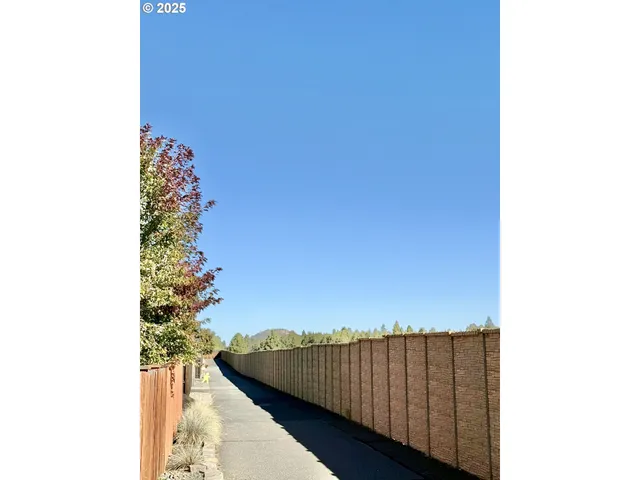 a view of a house with snow on the road