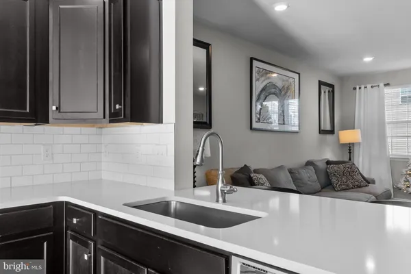 a kitchen with a sink and cabinets