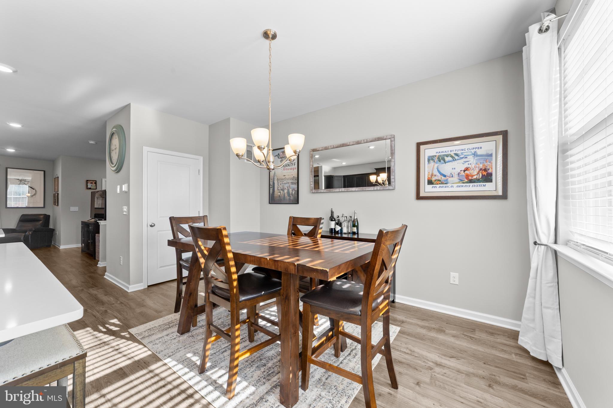 51 Turin Way Mount Laurel, NJ 08054 - Photo 12 of 35 a view of a dining room with furniture a chandelier and wooden floor