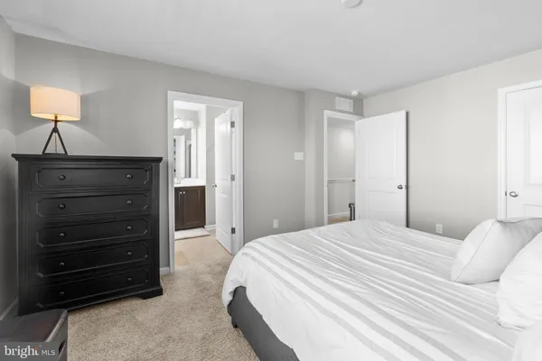 a bedroom with a bed and a closet
