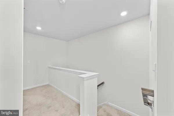 a living room with furniture a window and a table