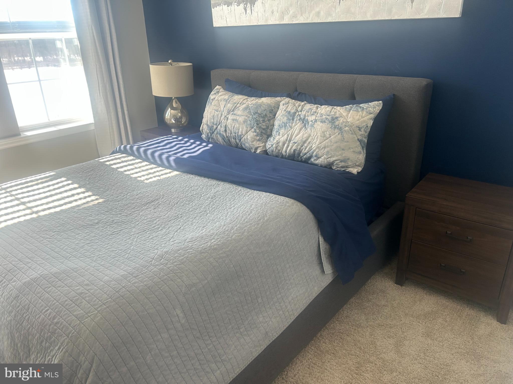 51 Turin Way Mount Laurel, NJ 08054 - Photo 31 of 35 a large bed sitting in a bedroom next to a window