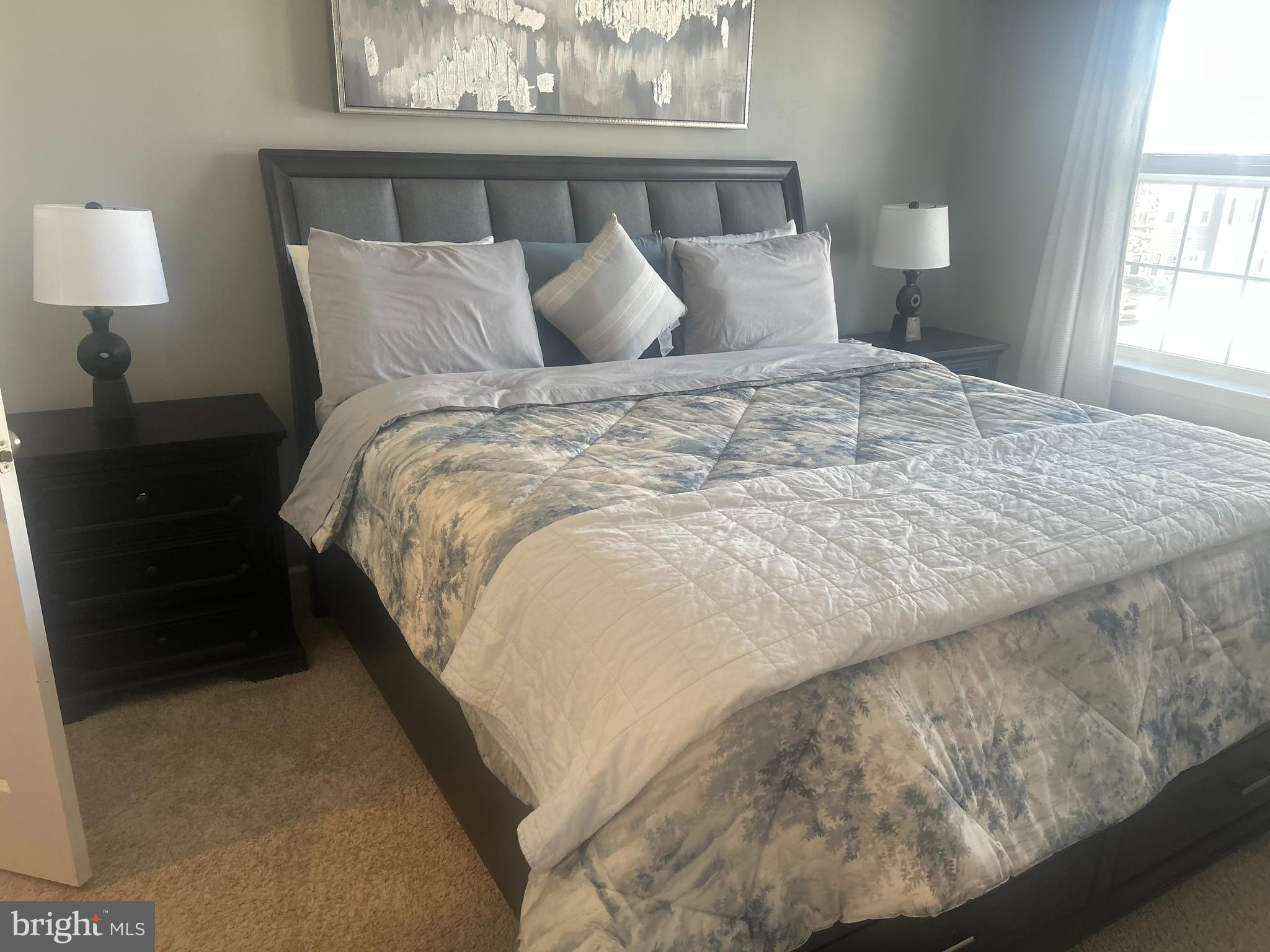 51 Turin Way Mount Laurel, NJ 08054 - Photo 32 of 35 a large bed sitting in a bedroom next to a window