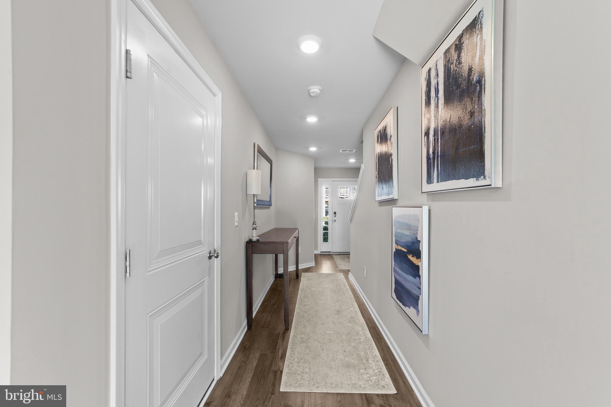 51 Turin Way Mount Laurel, NJ 08054 - Photo 6 of 35 a hallway with a white kitchen