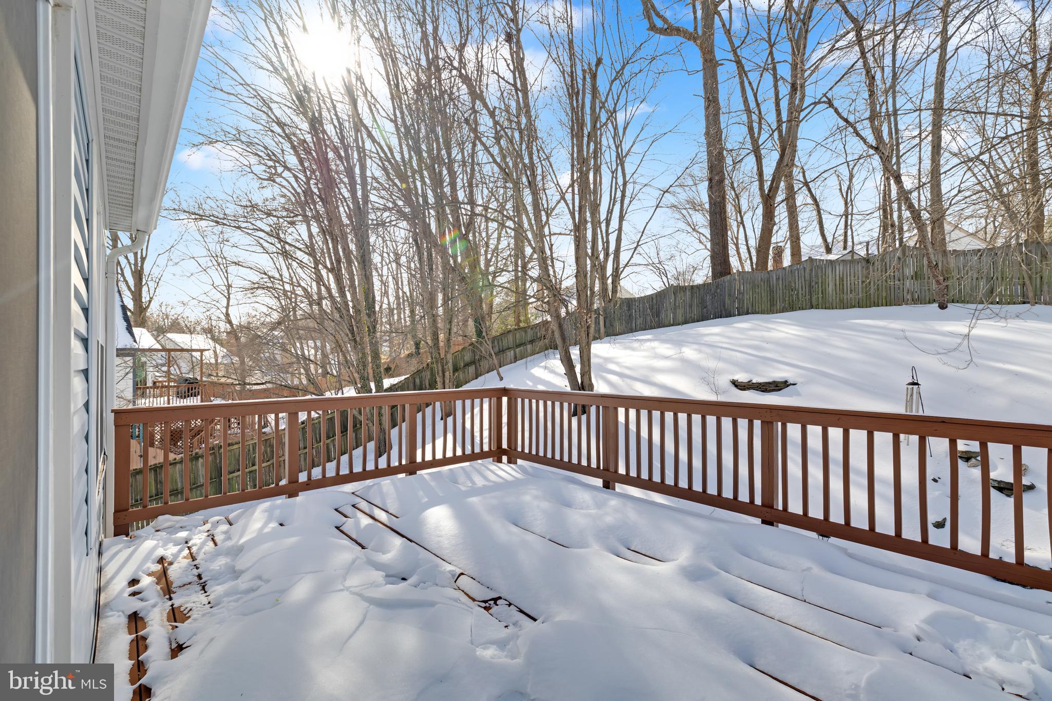9005 Triple Ridge Road Fairfax Station, VA 22039 - Photo 16 of 38 a view of a wooden roof deck