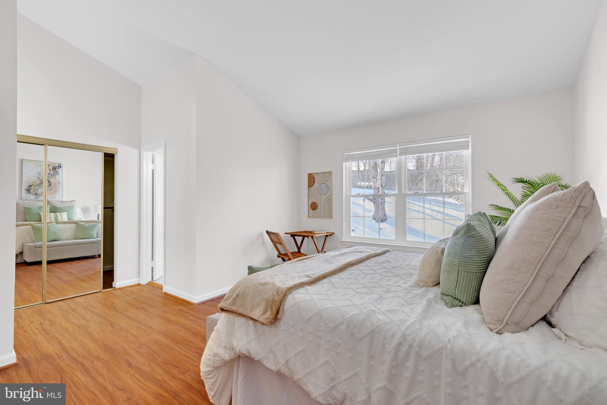9005 Triple Ridge Road Fairfax Station, VA 22039 - Photo 18 of 38 a bedroom with a large bed and a large window