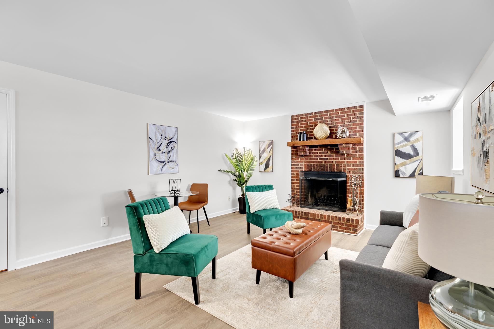 9005 Triple Ridge Road Fairfax Station, VA 22039 - Photo 27 of 38 a living room with furniture and a fireplace