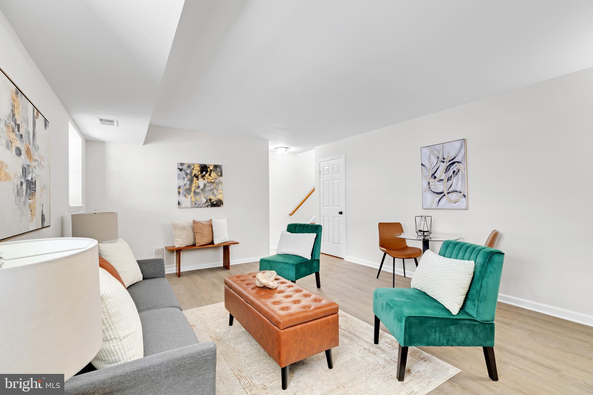 9005 Triple Ridge Road Fairfax Station, VA 22039 - Photo 29 of 38 a living room with furniture and a wooden floor