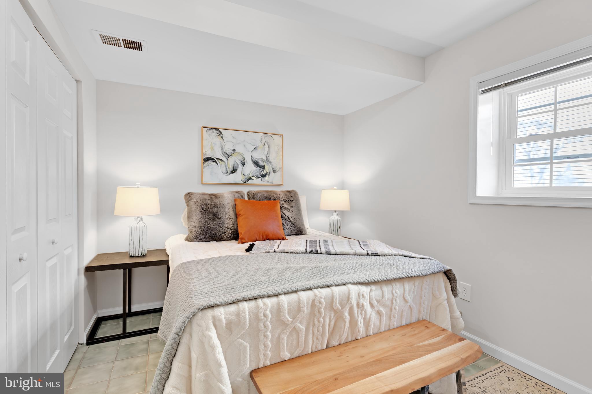 9005 Triple Ridge Road Fairfax Station, VA 22039 - Photo 32 of 38 a bedroom with a bed and window