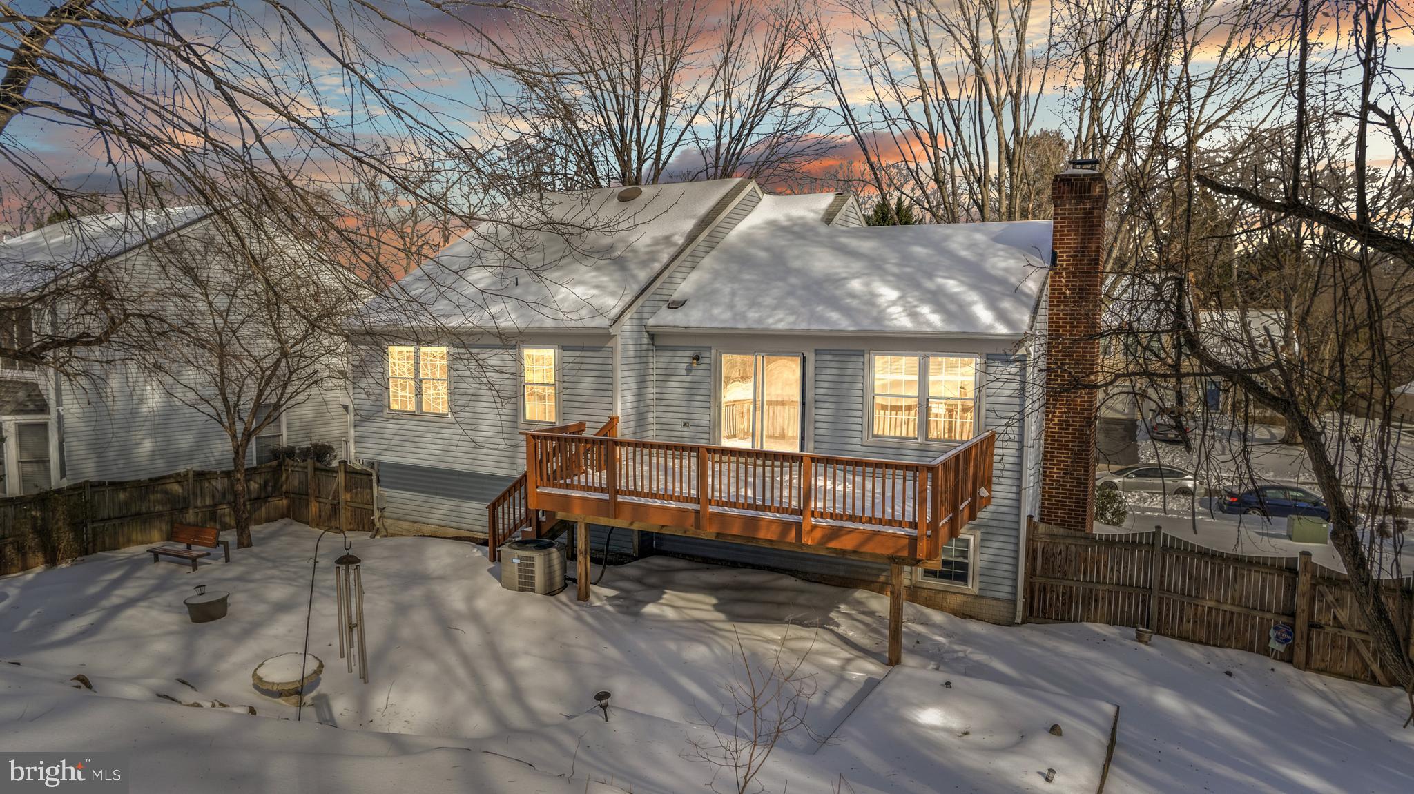 9005 Triple Ridge Road Fairfax Station, VA 22039 - Photo 34 of 38 a view of patio with a table and chairs and couches