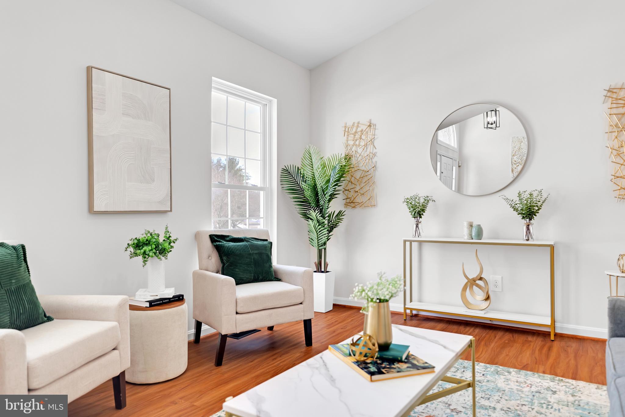 9005 Triple Ridge Road Fairfax Station, VA 22039 - Photo 5 of 38 a living room with furniture a lamp and a potted plant
