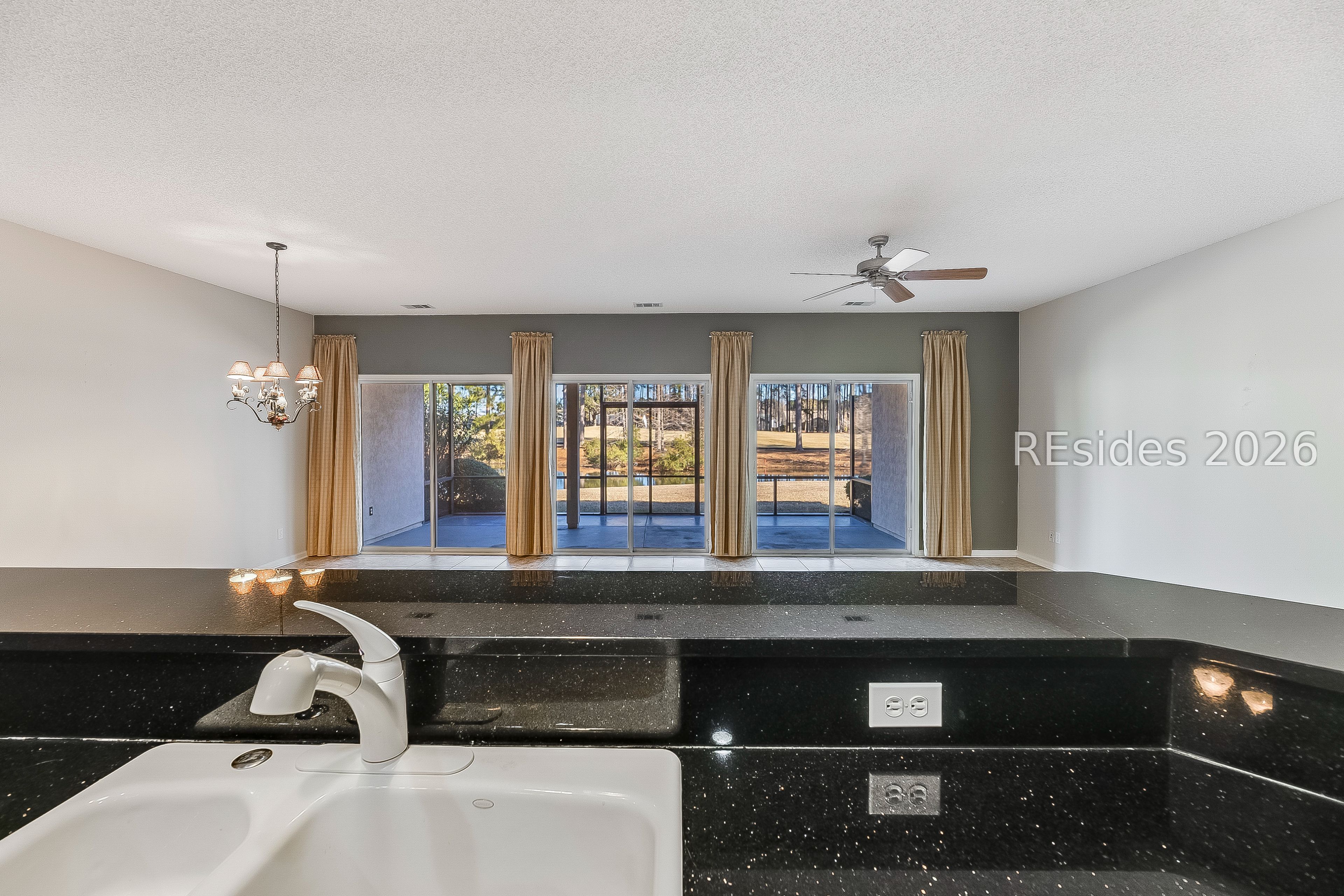 108 Landing Lane Bluffton, SC 29909 - Photo 20 of 52 Looking from kitchen to great room and lanai