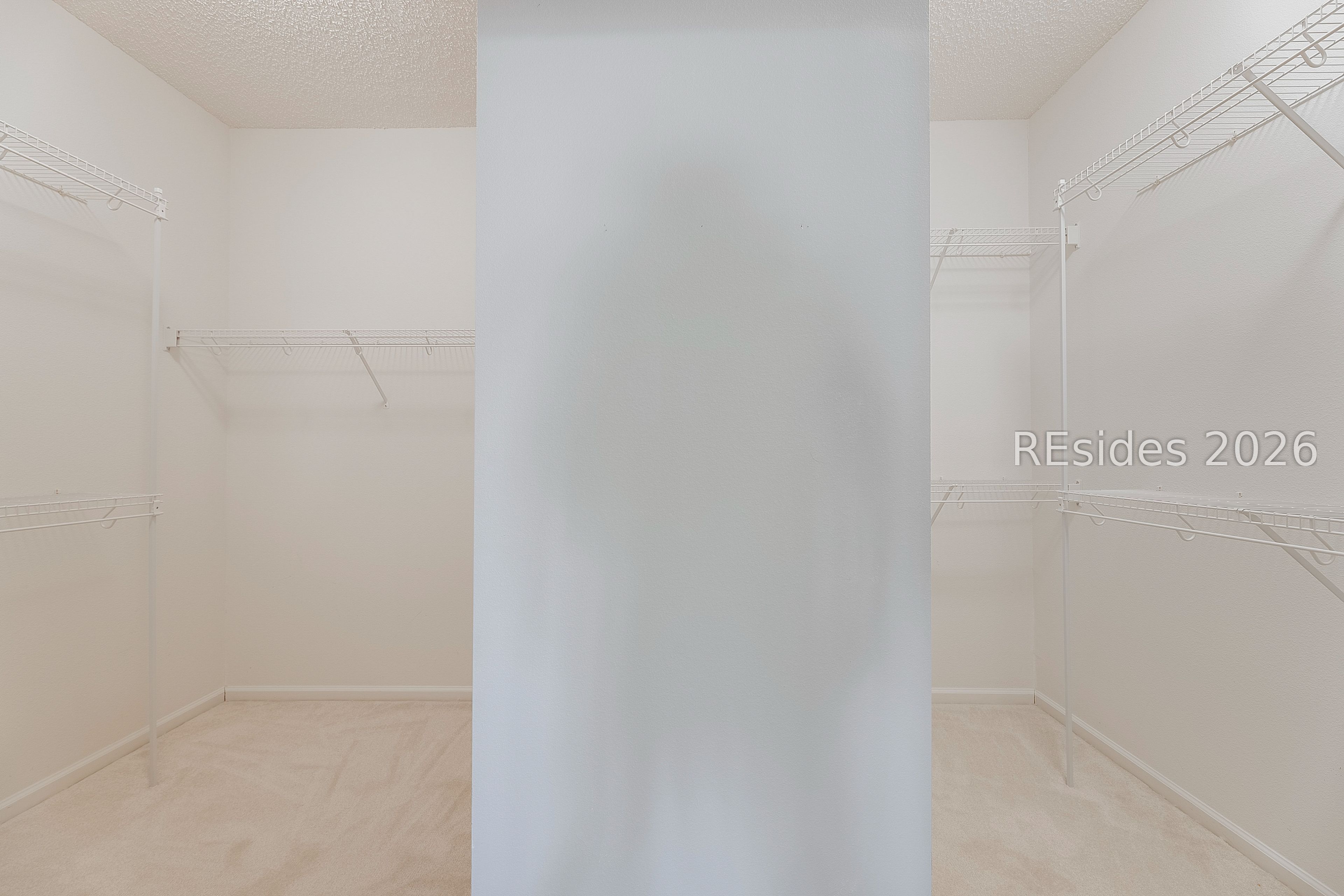 108 Landing Lane Bluffton, SC 29909 - Photo 36 of 52 Primary walk in closet with his and hers sides