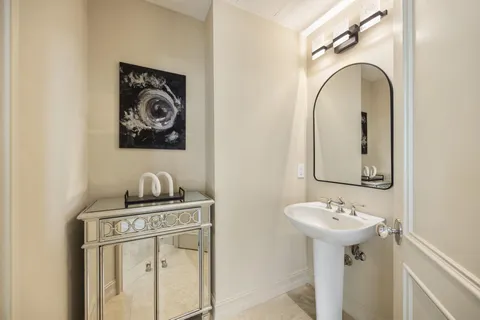 a bathroom with a sink and mirror