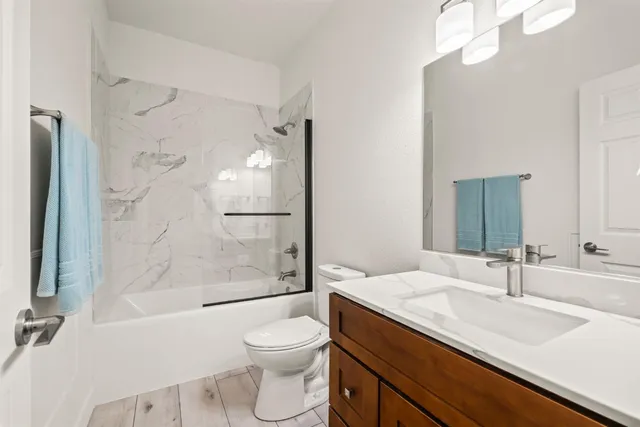 a view of a bathroom with the shower