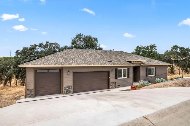 a front view of a house with a garage
