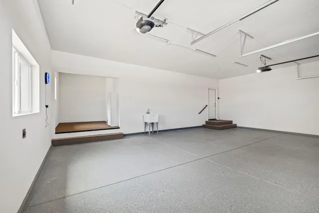 a view of balcony with wooden floor and fence