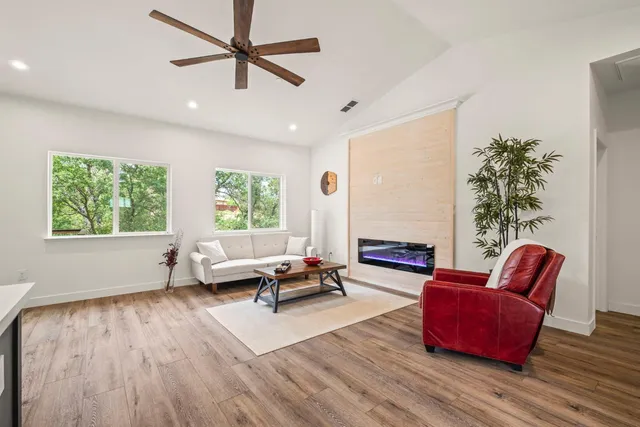 a living room with furniture and a large window