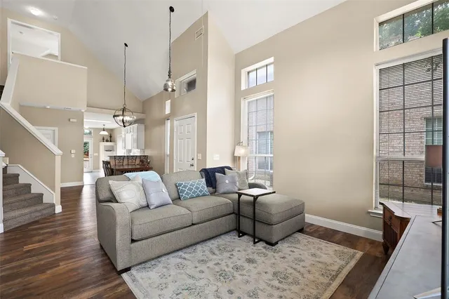 a living room with furniture and a rug