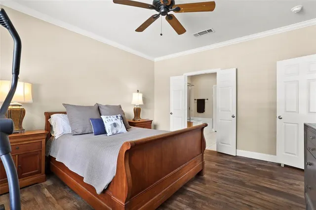 a bed room with a bed and a chandelier