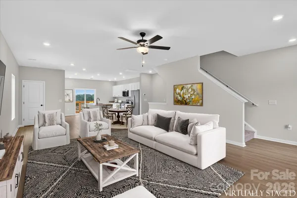 a living room with furniture and a rug