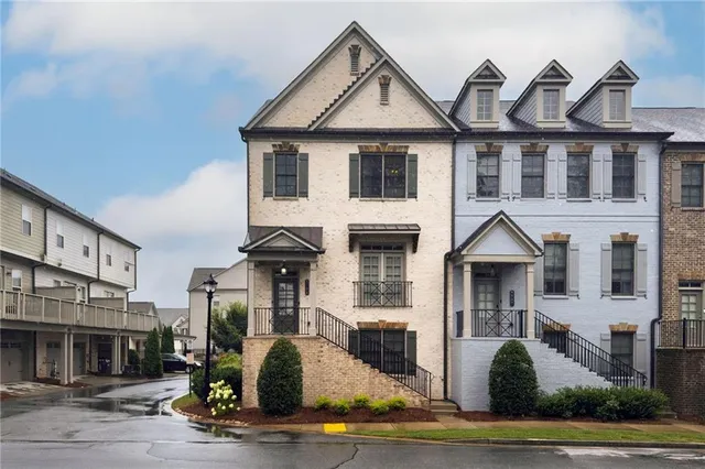 a front view of a house with yard