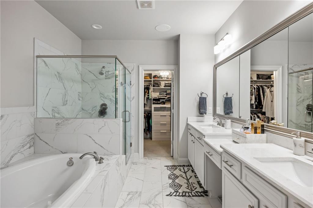 1799 Falling Sky Court Atlanta, GA 30319 - Photo 13 of 26 a spacious bathroom with a tub sink shower and mirror