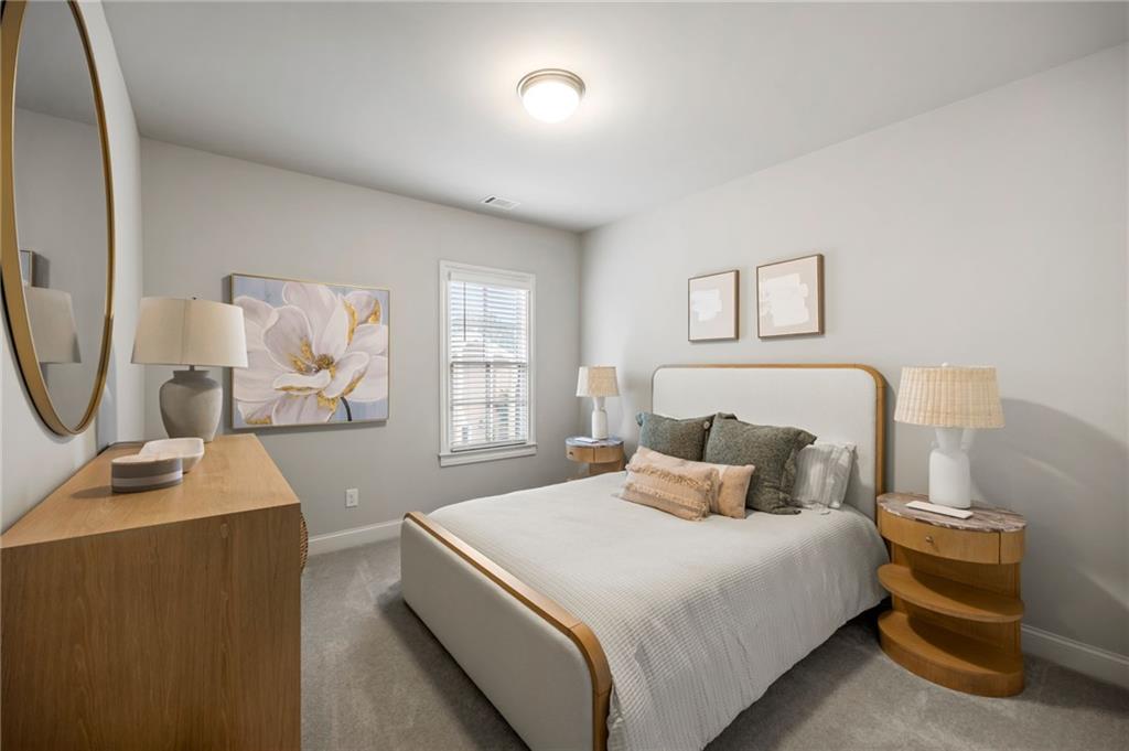 1799 Falling Sky Court Atlanta, GA 30319 - Photo 17 of 26 a bedroom with a bed and a window