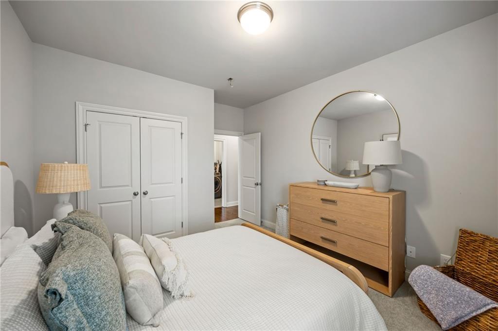 1799 Falling Sky Court Atlanta, GA 30319 - Photo 18 of 26 a bedroom with a bed and a dresser