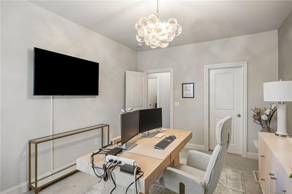 1799 Falling Sky Court Atlanta, GA 30319 - Photo 20 of 26 a view of a livingroom with furniture and a flat screen tv
