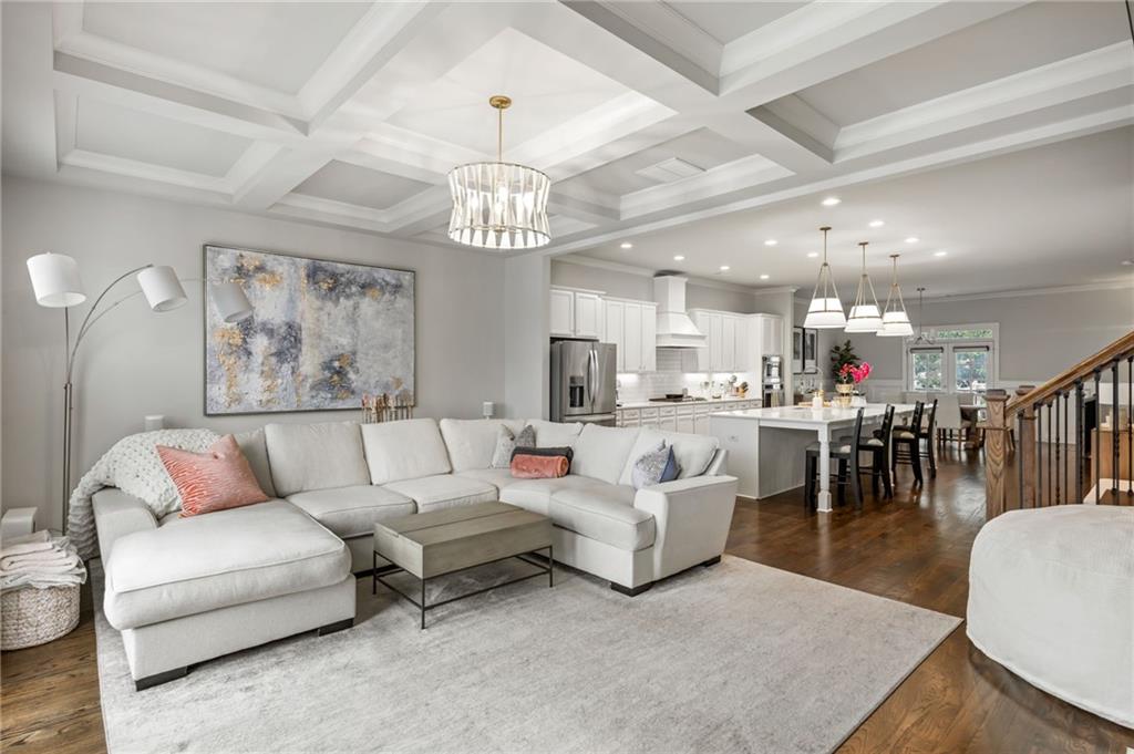 1799 Falling Sky Court Atlanta, GA 30319 - Photo 8 of 26 a living room with furniture kitchen and a chandelier