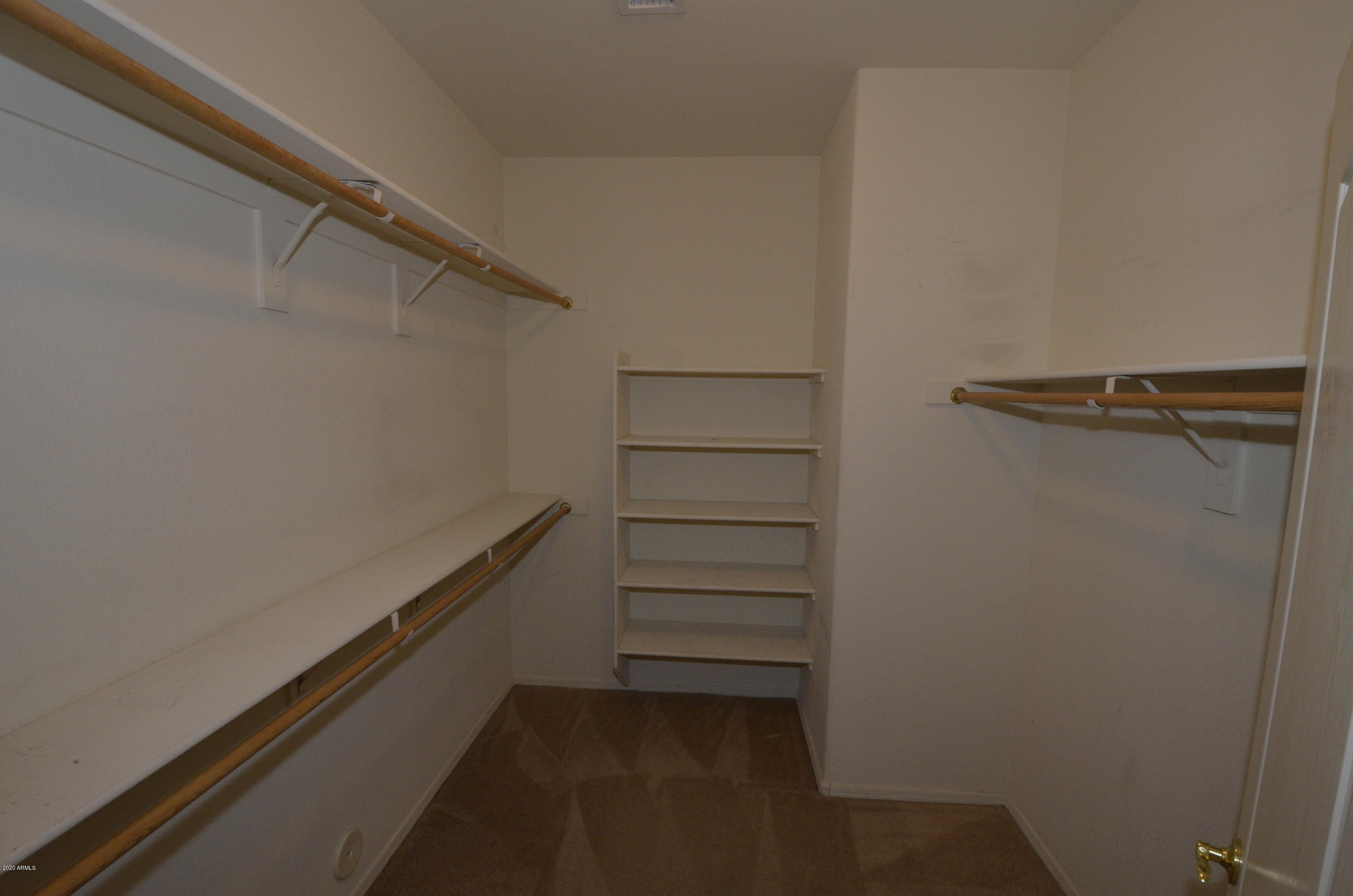1148 South Roca Street Gilbert, AZ 85296 - Photo 11 of 20 a view of walk in closet