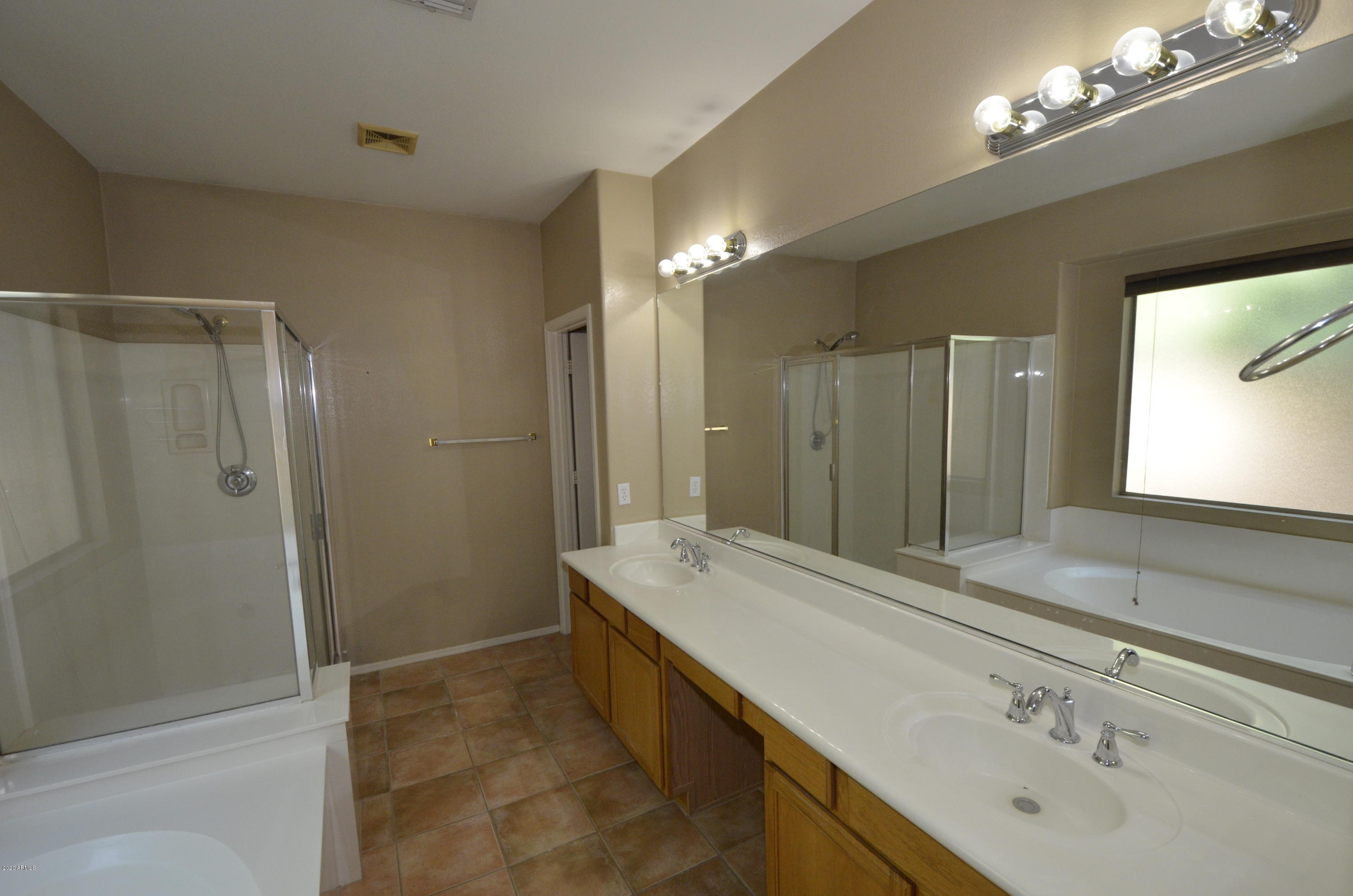 1148 South Roca Street Gilbert, AZ 85296 - Photo 14 of 20 a bathroom with a sink double vanity and a mirror