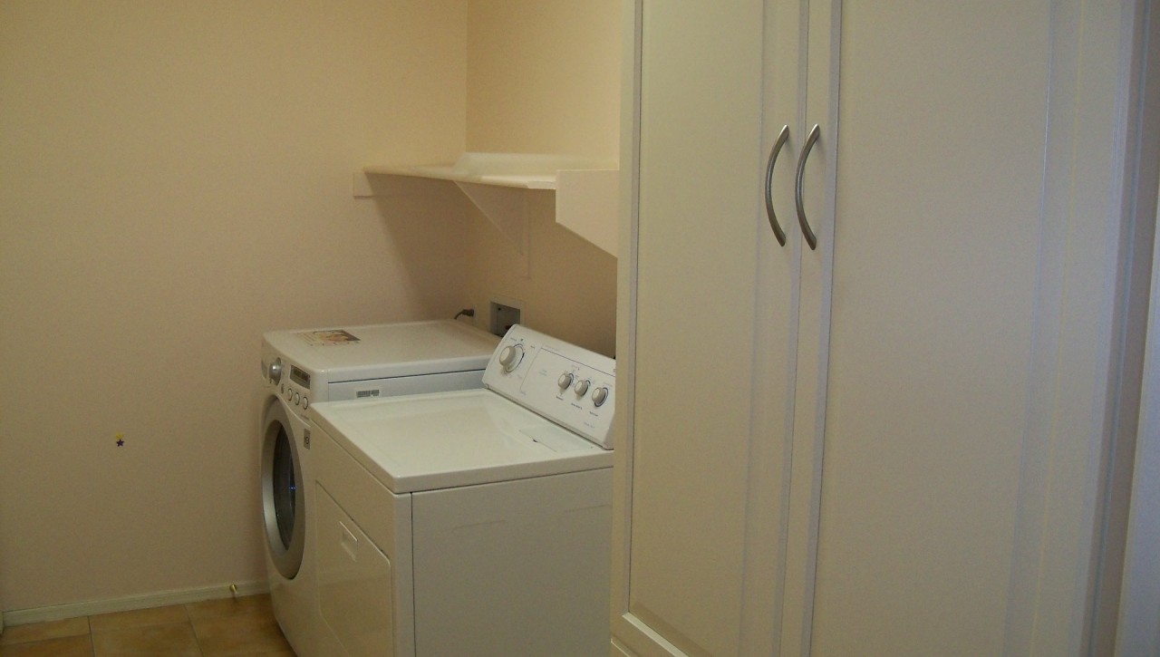 1148 South Roca Street Gilbert, AZ 85296 - Photo 19 of 20 a utility room with dryer and washer