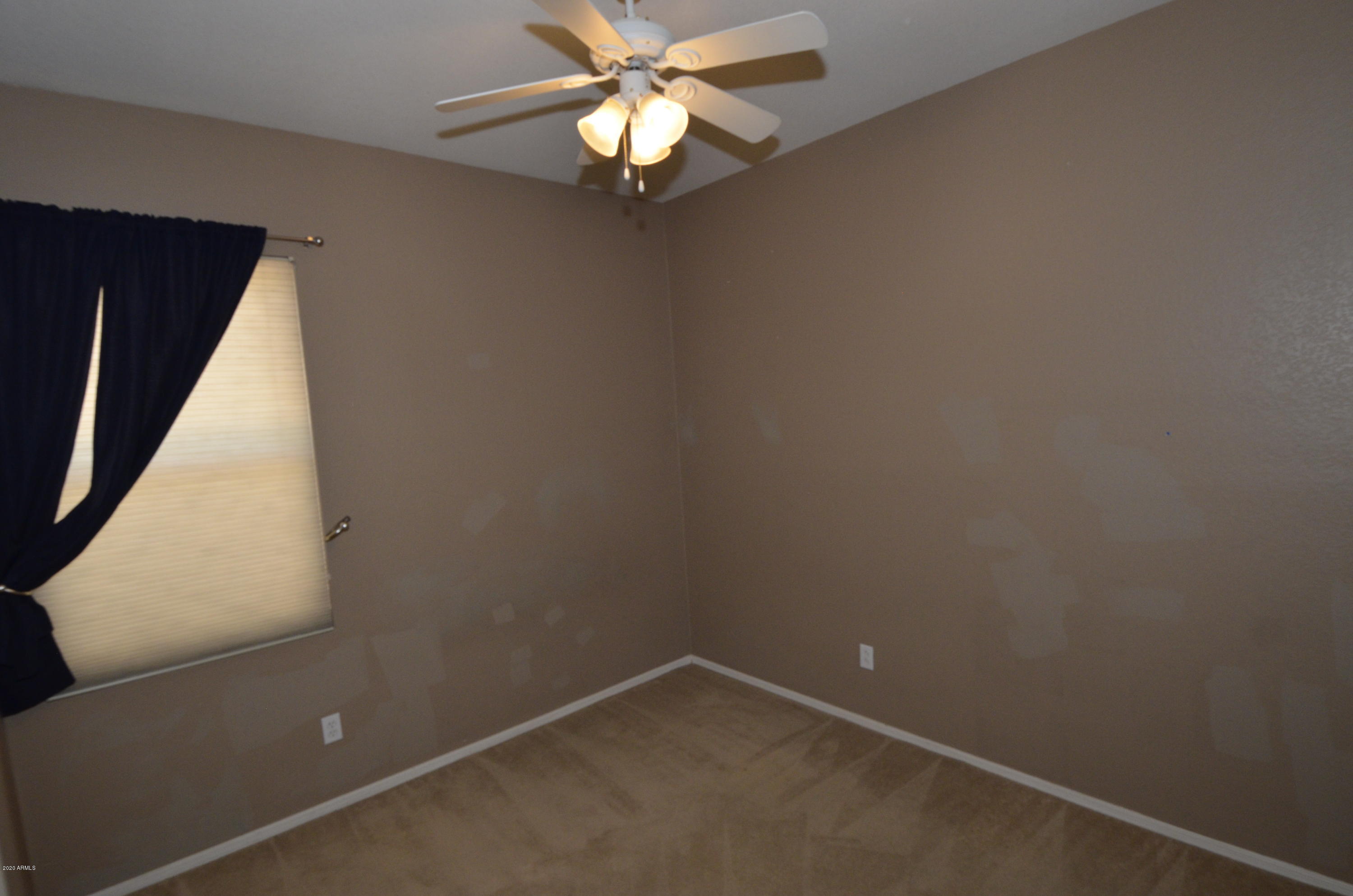 1148 South Roca Street Gilbert, AZ 85296 - Photo 20 of 20 a view of an empty room with a window
