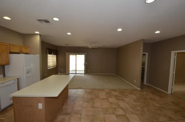 a kitchen with stainless steel appliances a refrigerator and a stove top oven