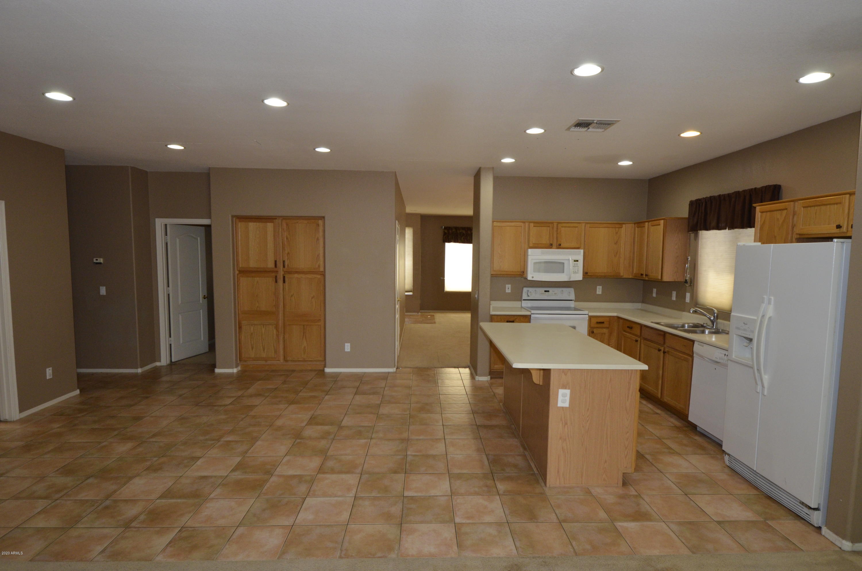 1148 South Roca Street Gilbert, AZ 85296 - Photo 8 of 20 a large kitchen with stainless steel appliances lots of counter top space