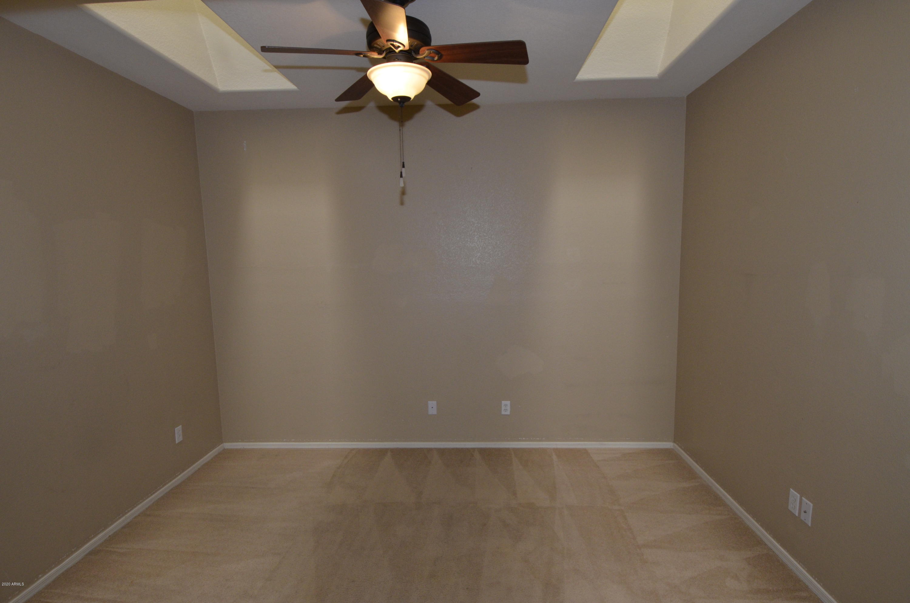 1148 South Roca Street Gilbert, AZ 85296 - Photo 9 of 20 an empty room with a chandelier fan and closet