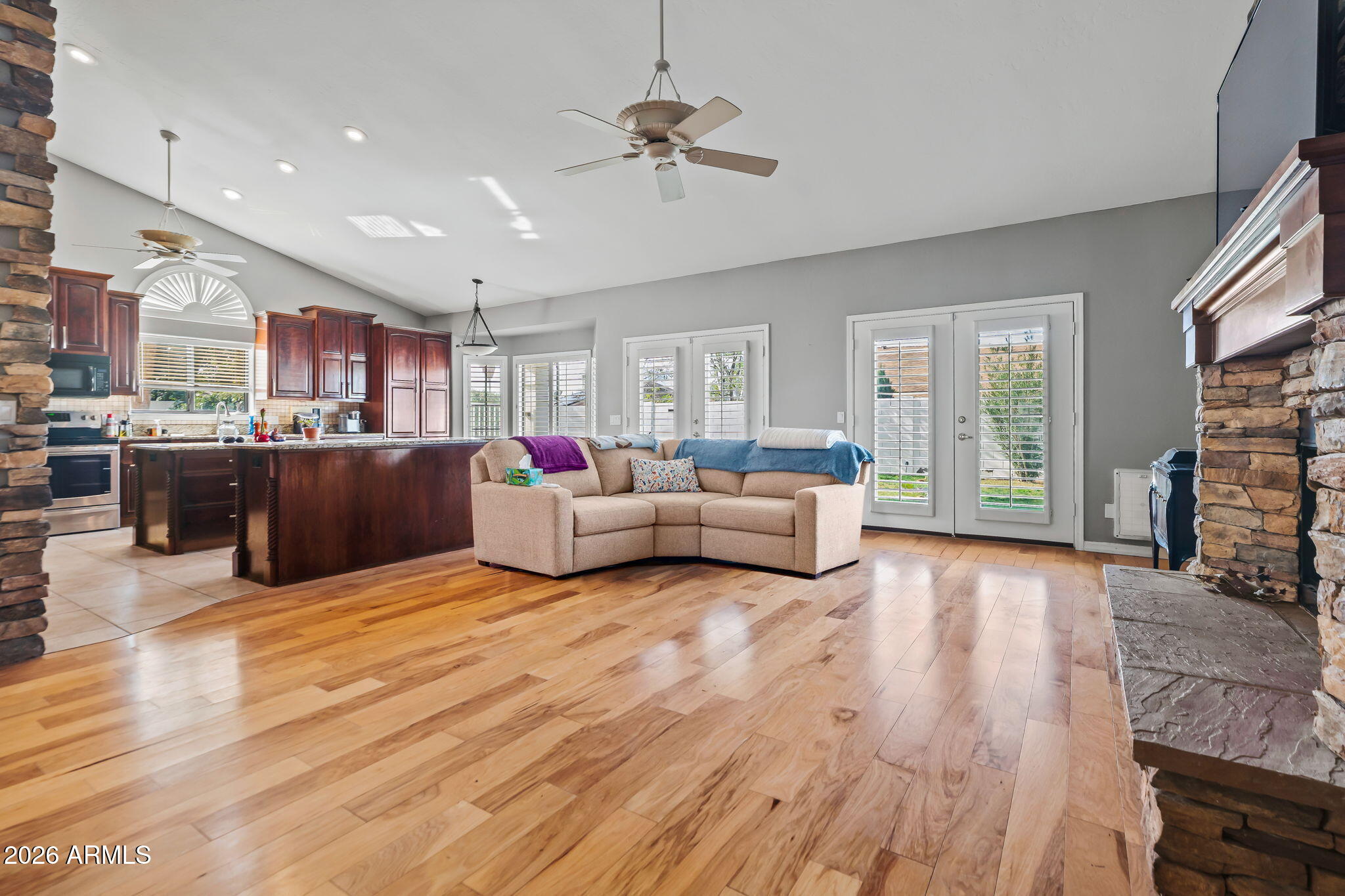 1038 South 38th Street Mesa, AZ 85206 - Photo 19 of 59 a living room with furniture and a kitchen