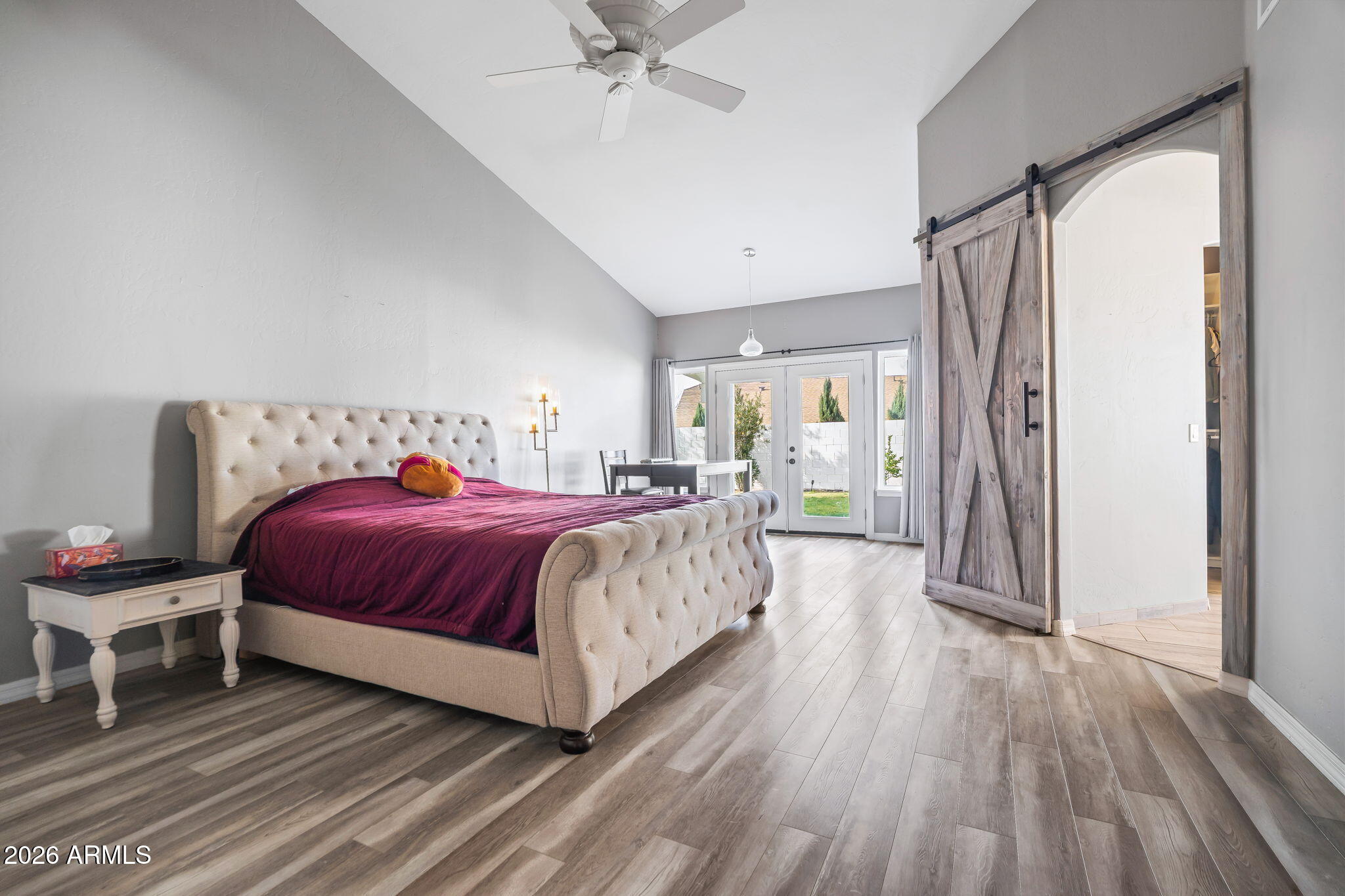 1038 South 38th Street Mesa, AZ 85206 - Photo 29 of 59 a bedroom with a bed and a chandelier