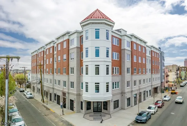 a front view of a building with street view