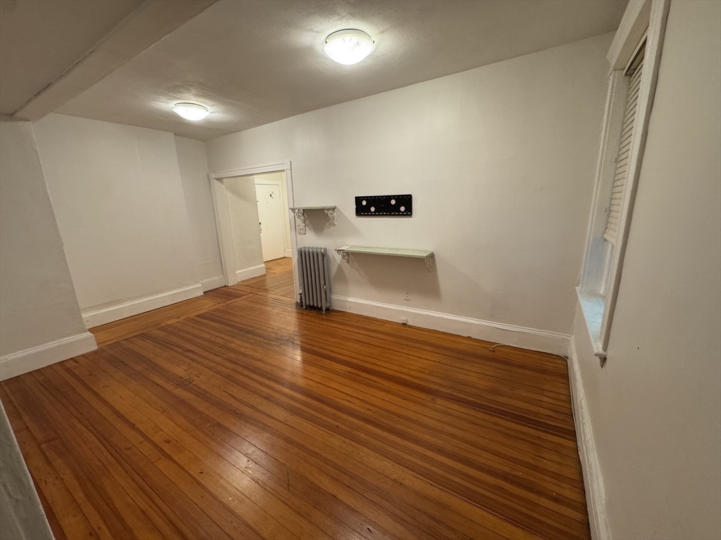 31 Westbourne Terrace, Unit 2 Brookline, MA 02446 - Photo 9 of 15 a view of empty room with wooden floor