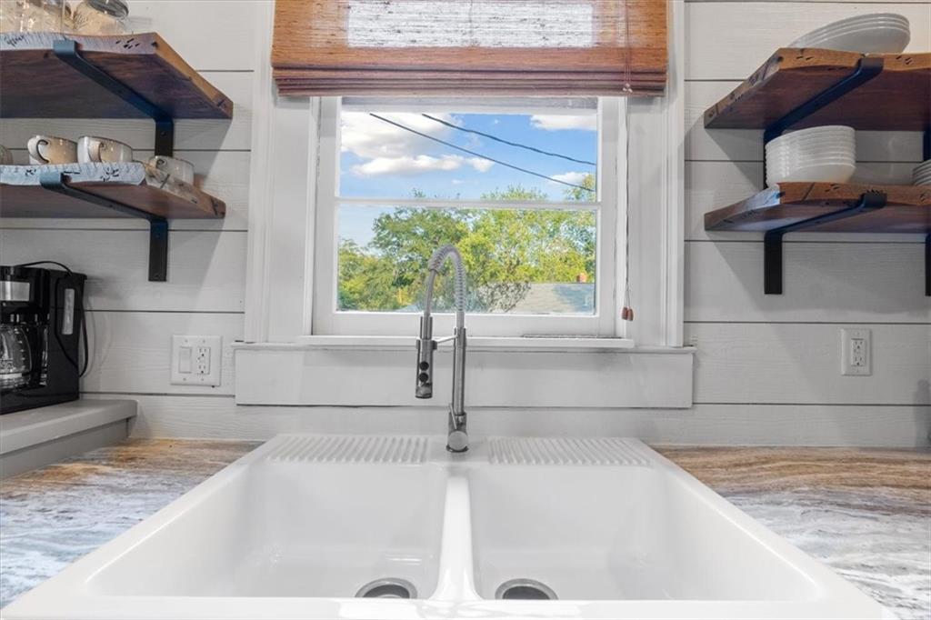 5143 Floyd Street Northeast Covington, GA 30014 - Photo 12 of 27 a kitchen with a sink and a window