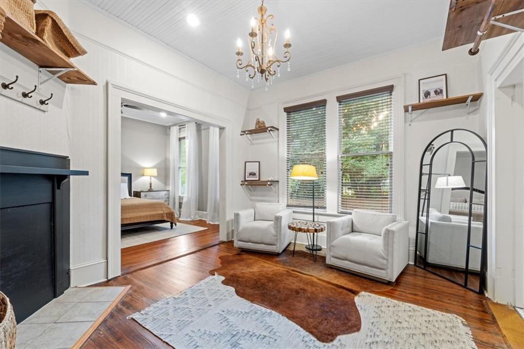 5143 Floyd Street Northeast Covington, GA 30014 - Photo 13 of 27 a living room with furniture and a chandelier