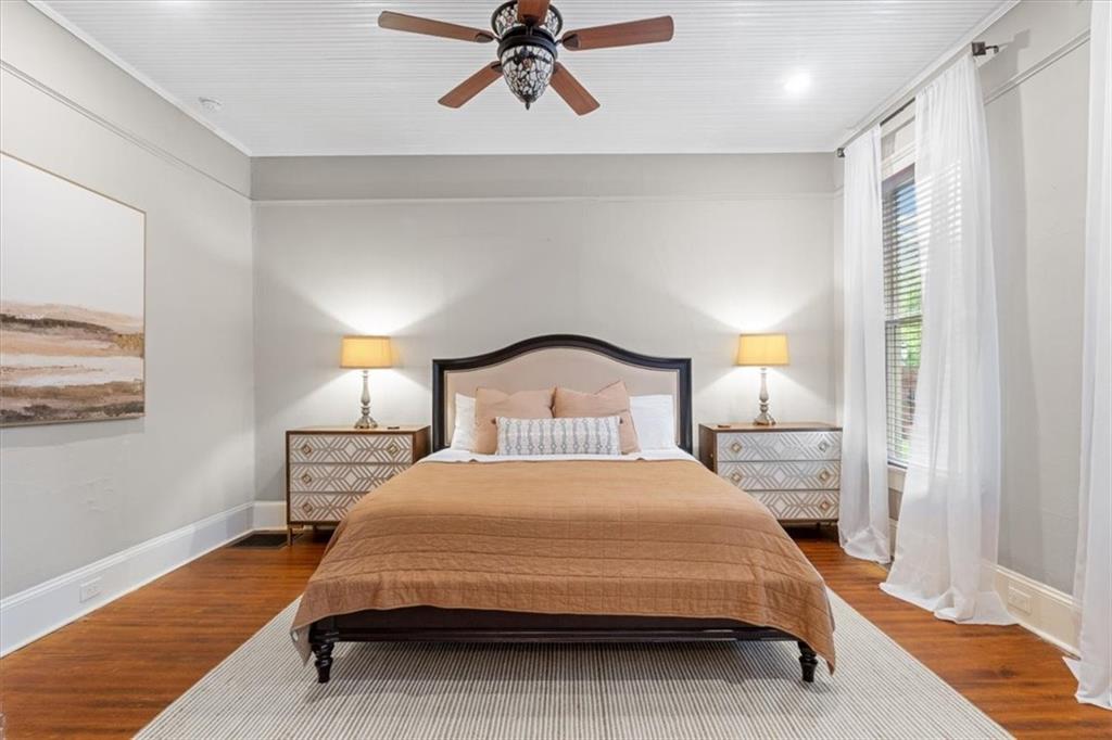 5143 Floyd Street Northeast Covington, GA 30014 - Photo 14 of 27 a bedroom with a bed lamps and window